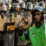 Protes di Indonesia: Warga Asia menggunakan Grab dan Gojek untuk mengirim makanan dan dukungan bagi pengemudi pengiriman.